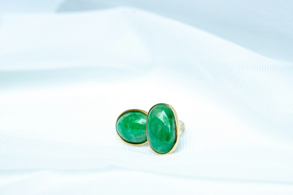 a pair of green and black dice