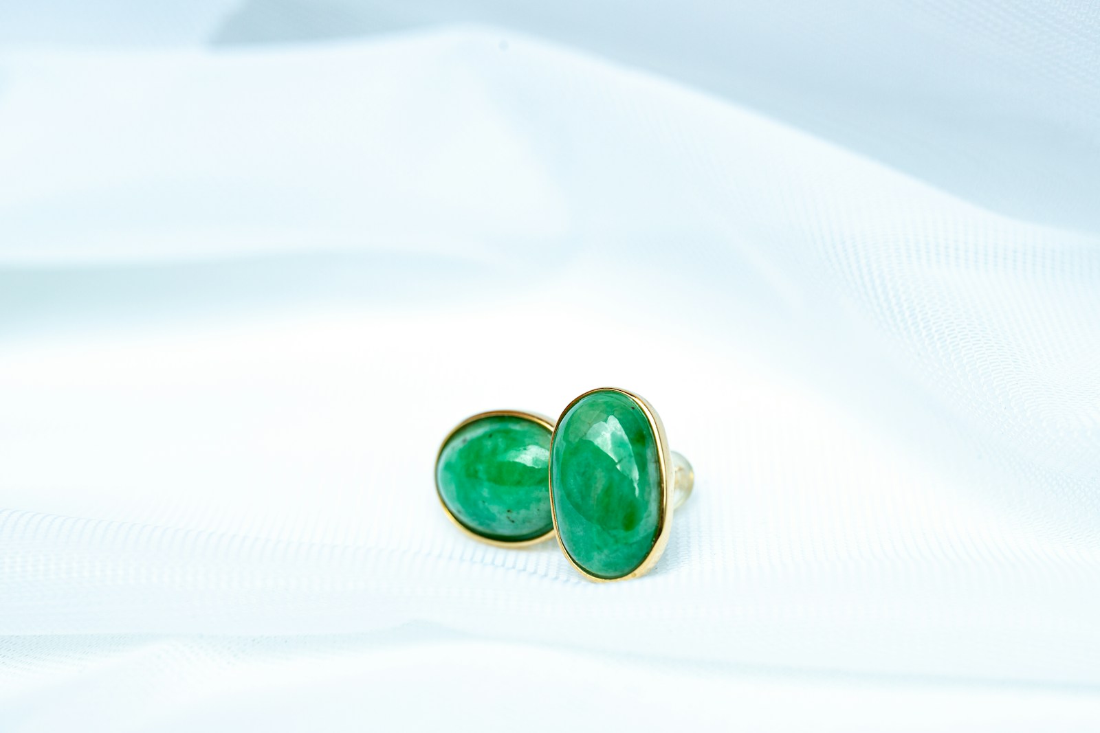 a pair of green and black dice